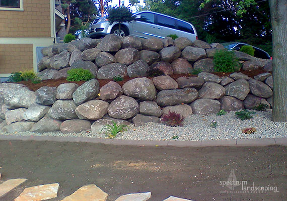 Boulder wall by Spectrum Landscaping Inc